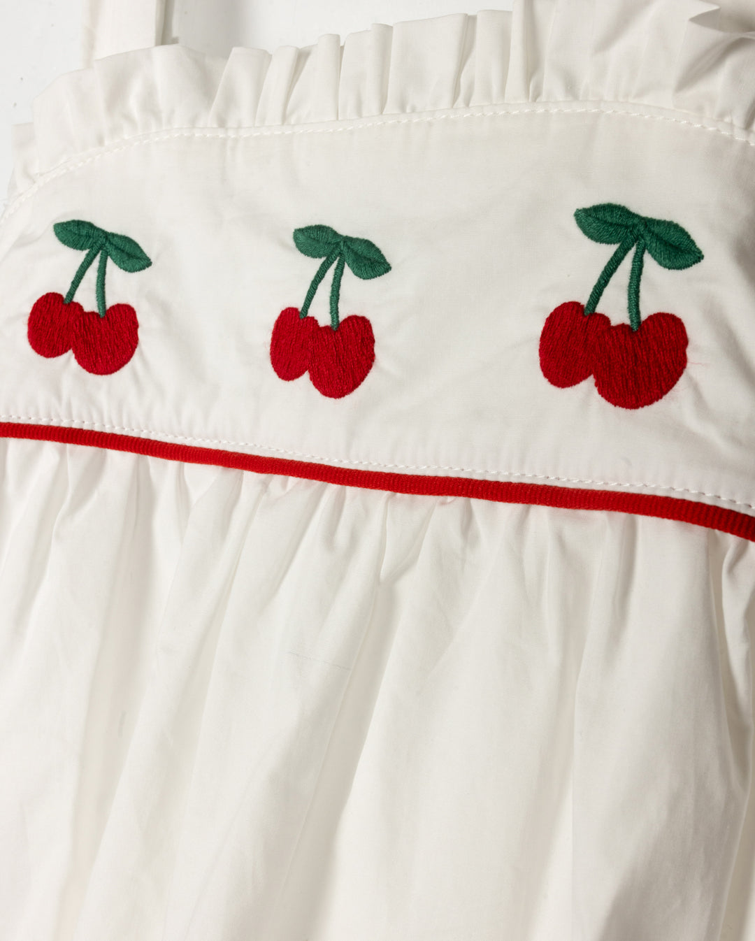 one piece cherry embroidered crossback romper - white