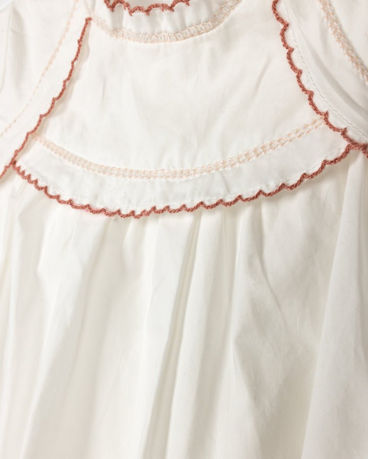 one piece s/s scalloped bib - white