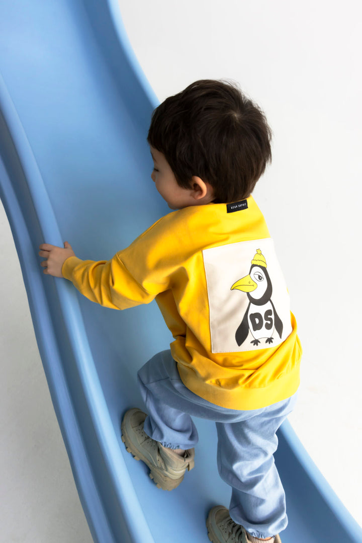 top l/s penguin back sweatshirt - yellow